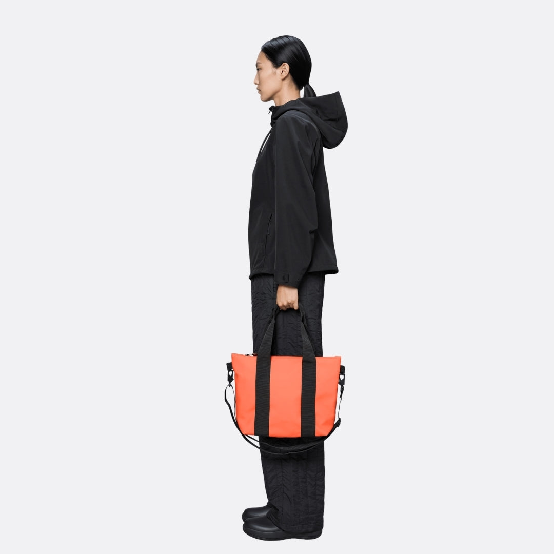 <PRODUCTTITLE> in Orange by Rains.