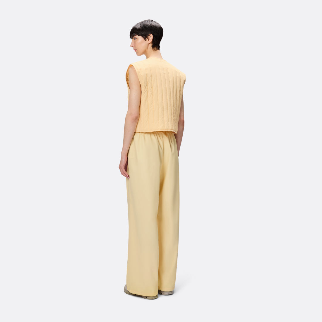 <PRODUCTTITLE> in Yellow by Rains.