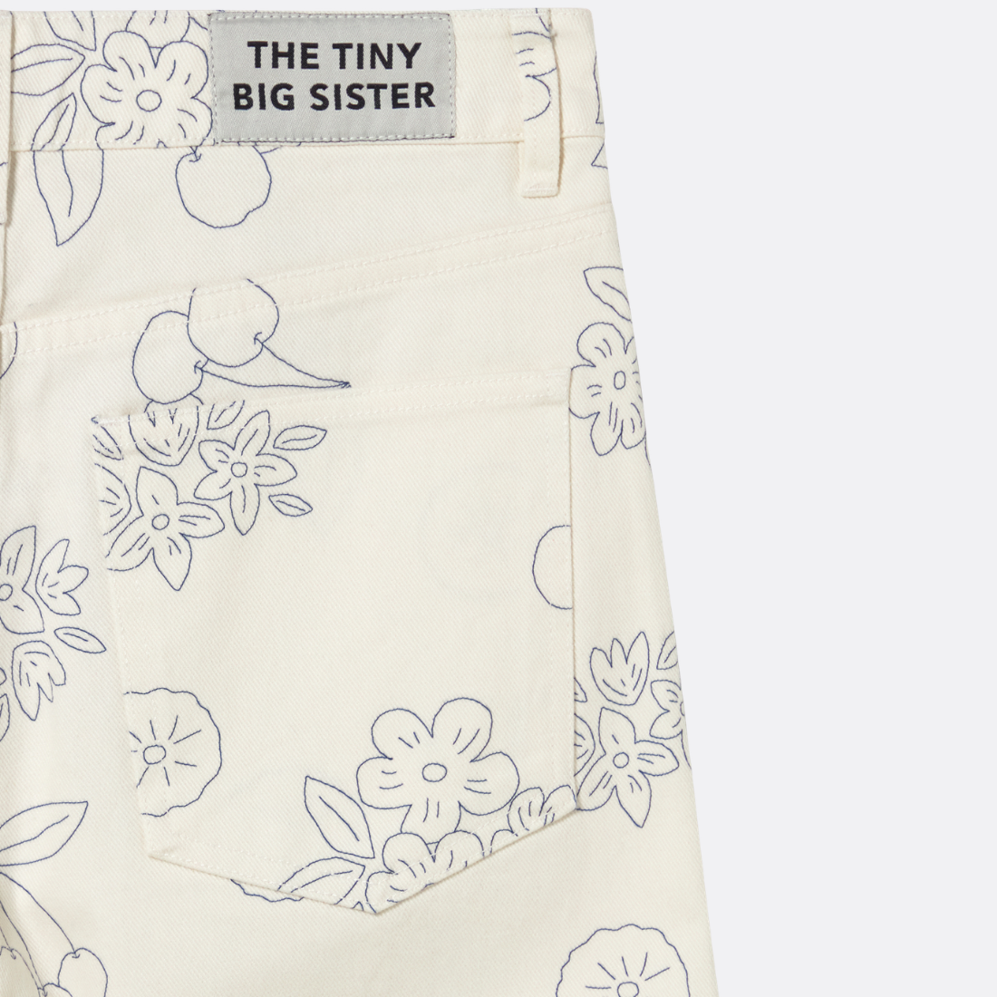 <PRODUCTTITLE> in White by Tiny Big Sister.