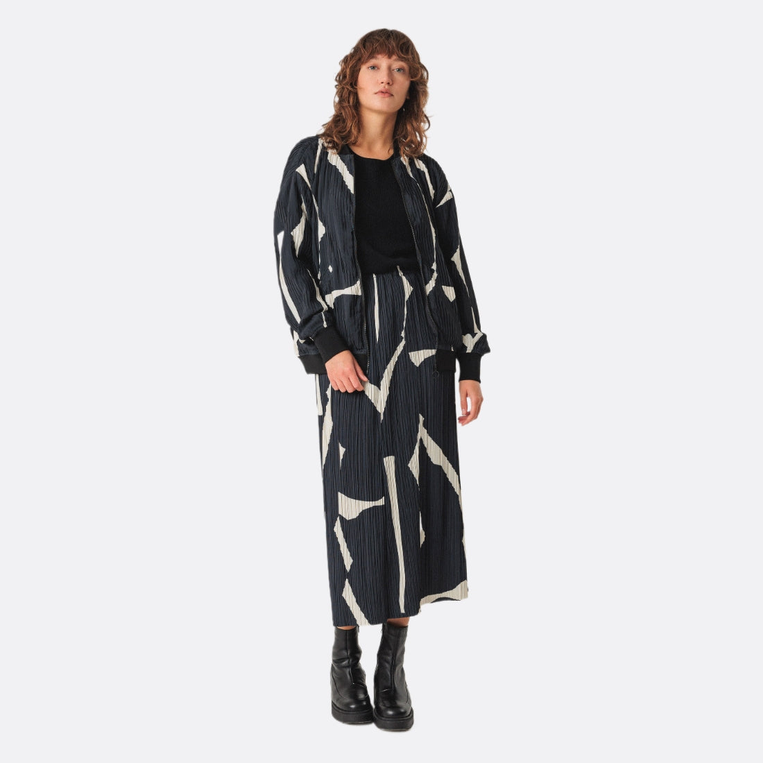 <PRODUCTTITLE> in Black by SKFK.