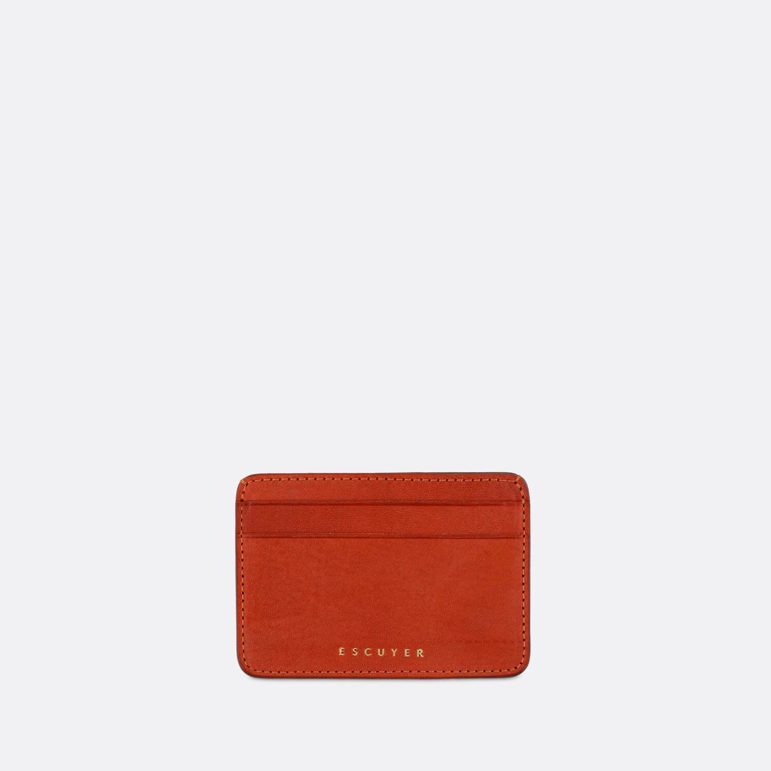Sophisticated orange leather cardholder for cards and folded notes.