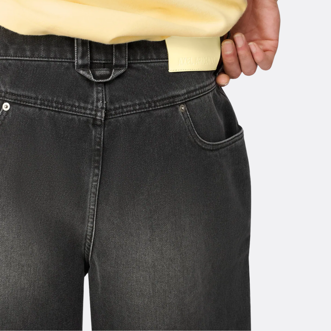 <PRODUCTTITLE> in Black by Axel Arigato.