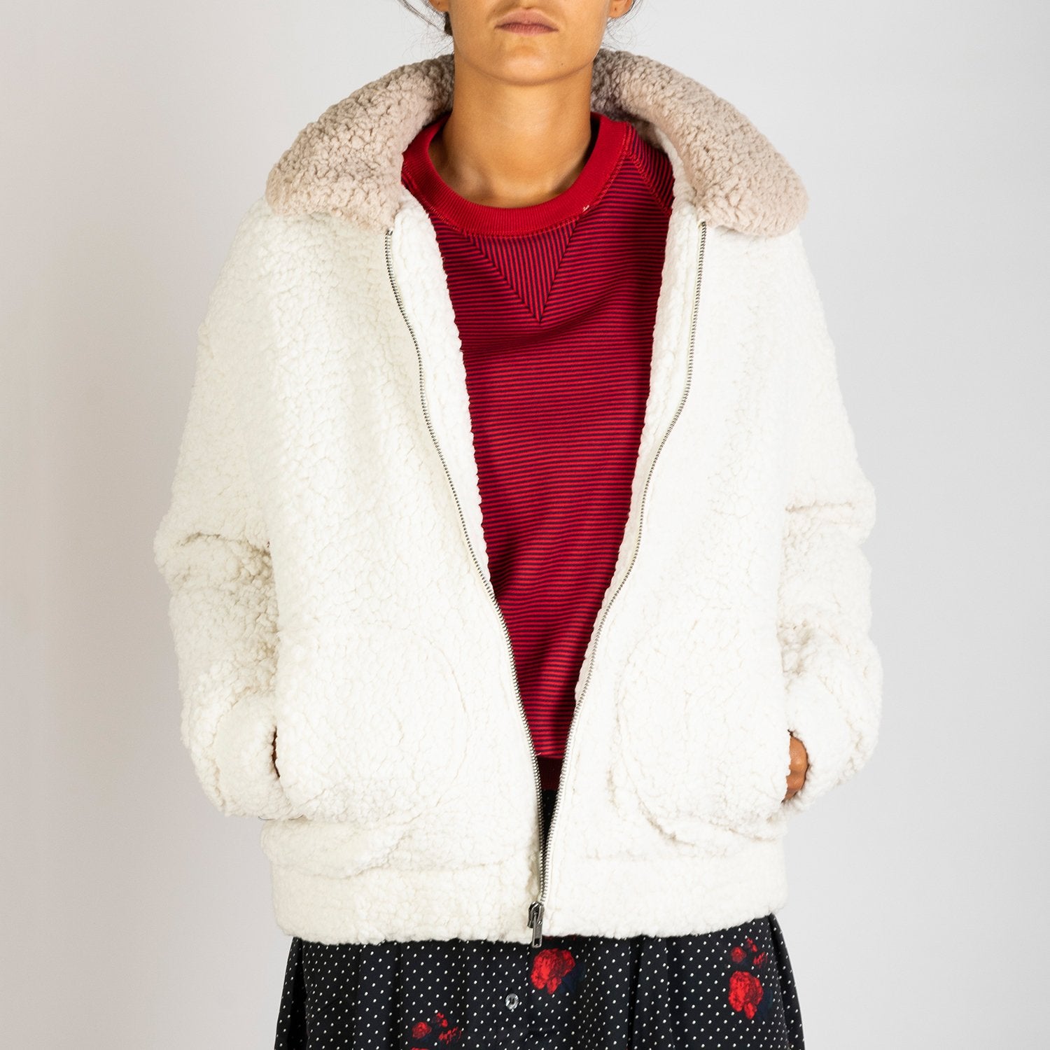 Soft white colored coat with an oatmeal collar. 