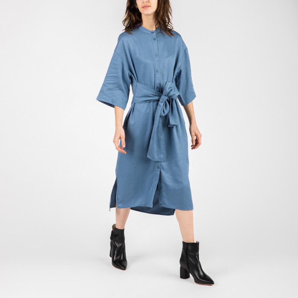 Blue midi length dress with dropped shoulder and self tie waist.