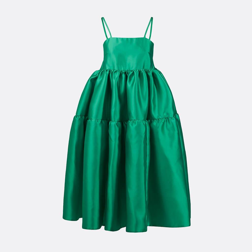 100% polyester long dress in green with spaghetti straps, two ruffles and string fastening on the back.